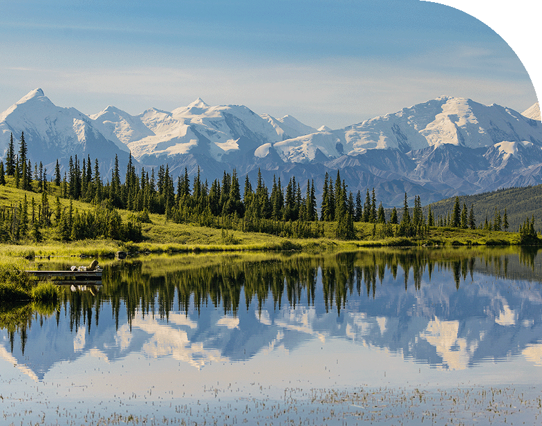 A mountain range reflected in a lake in Denali National Park, Alaska.