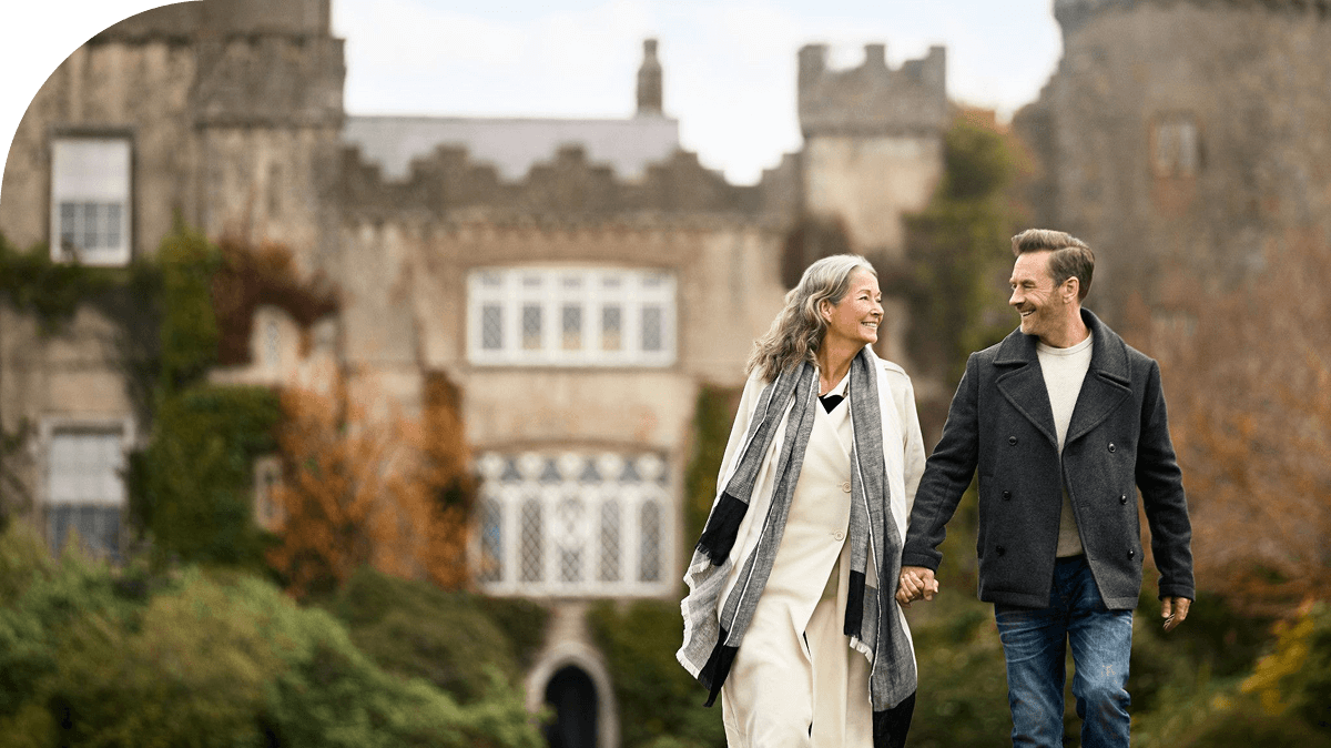A couple enjoys a stroll nearby Malahide Castle in Dublin, Ireland