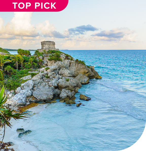 Ancient Mayan ruins perched on cliffs overlooking the Caribbean Sea.