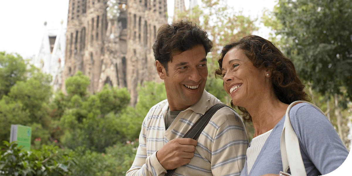 Two travellers enjoy the town of Barcelona, Spain.