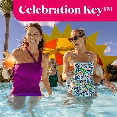 Celebration Key, two women with drink in the pool.