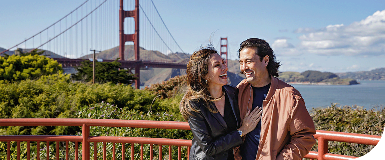 A couple enjoys the Golden Gate Bridge in San Francisco, California.
