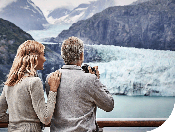 A couple viewing glaciers aboard a Princess ship.