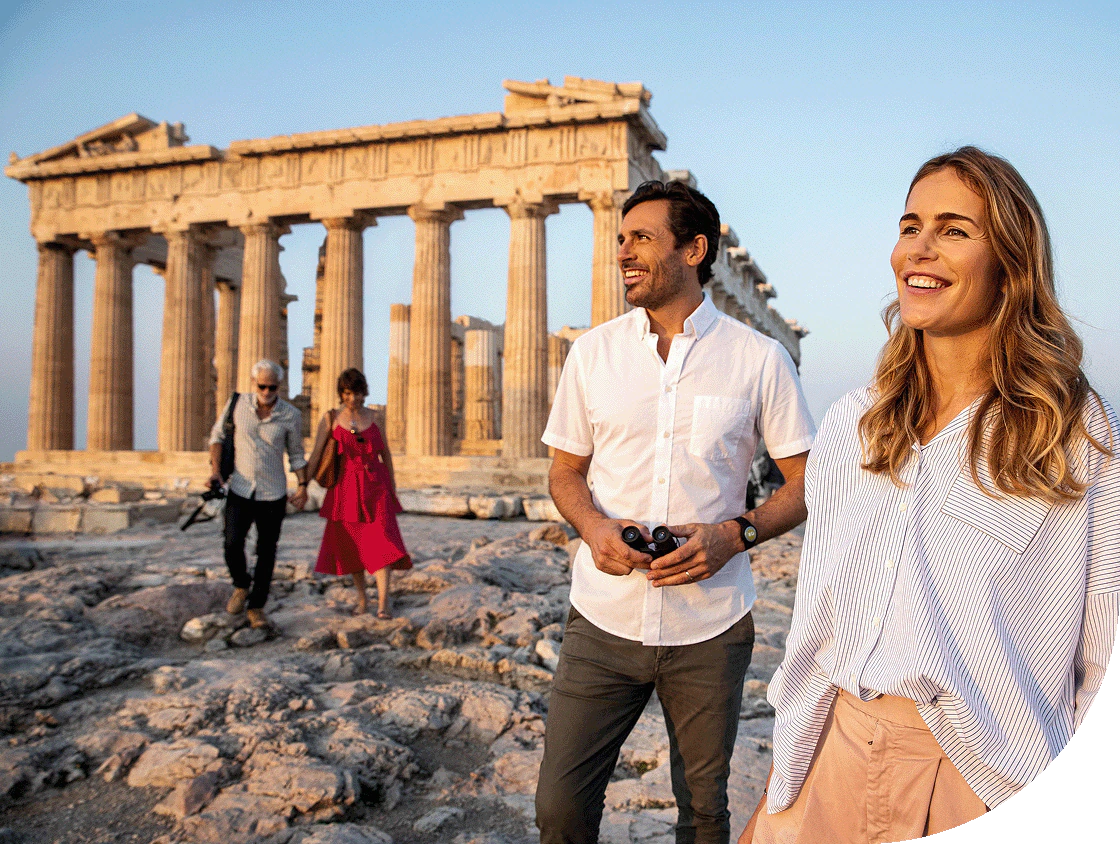 A couple enjoys touring the Acropolis.