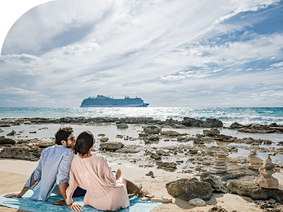 A couple relaxes in the Caribbean on a sunny day at the beach..