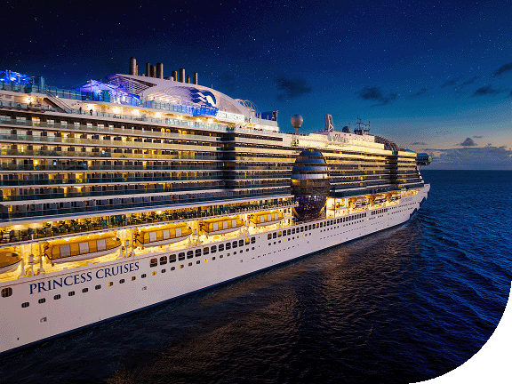 The Sun Princess sails on a starlit night in the Caribbean.