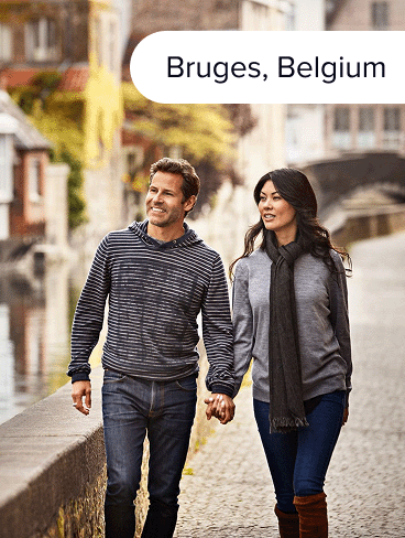 Two travelers stroll through Bruges, Belgium.