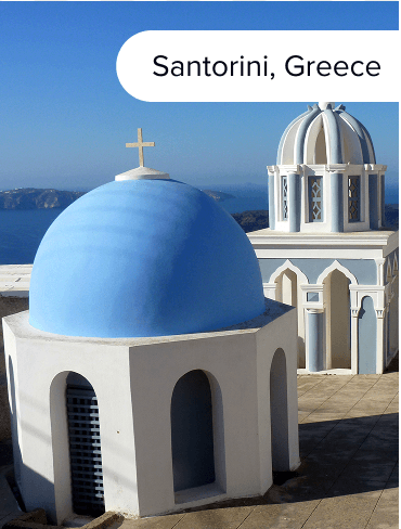 Iconic blue roof buildings of Santorini Greece.