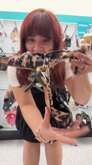 Woman showing cheetah kitten heels