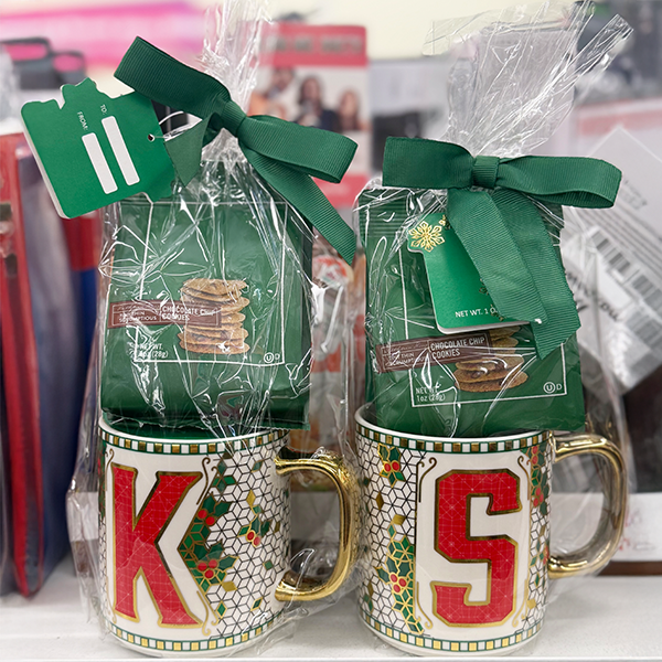 Two holiday themed mug with a bag of cookies. One with a 