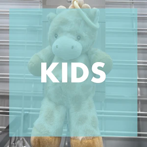 Brown and cream giraffe with a teal overlay that says 