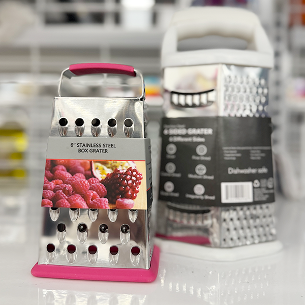 Two box graters one pink and one white