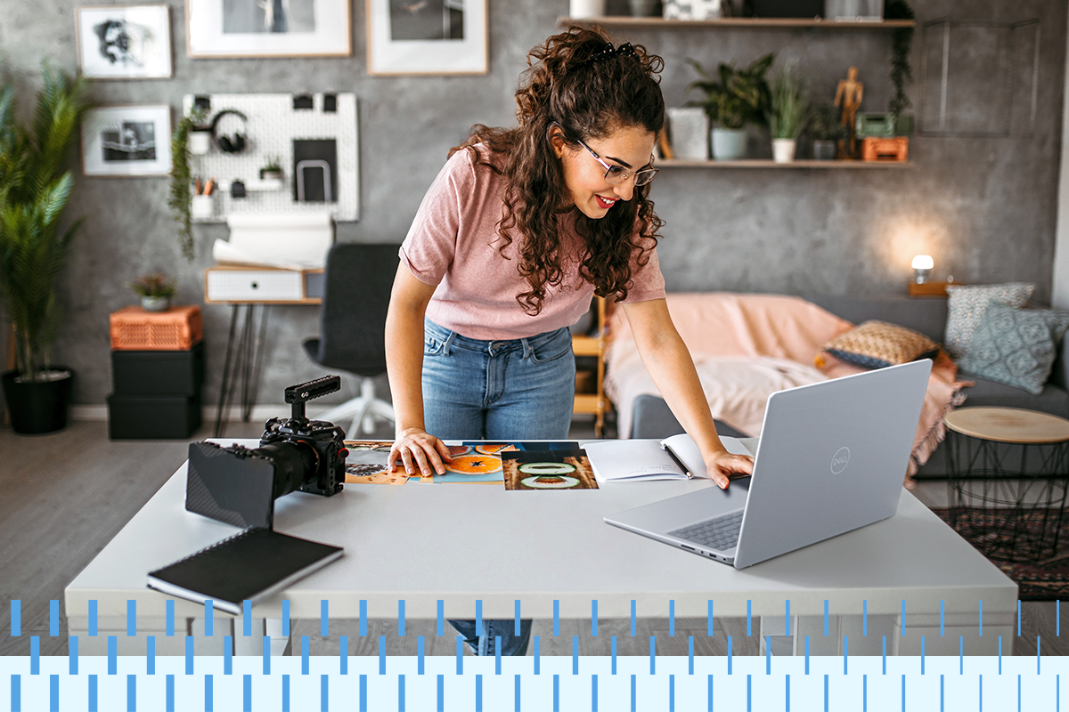 Woman working with Dell Inspiron 16 5000 Series non-touch notebook
