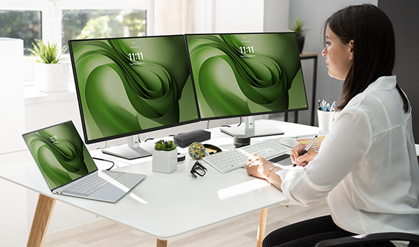 Graphic Designer Artist Working On Multiple Computer Screens