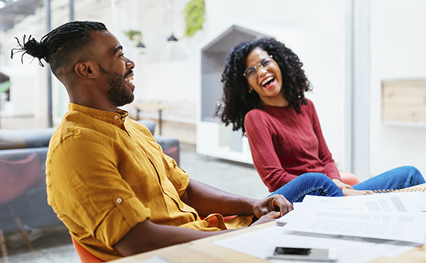 Laughing co workers in common space