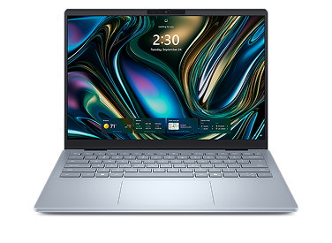 A Dell laptop computer on a dark gray background.