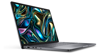 Side view of a Dell laptop computer on a dark gray                                                 background.