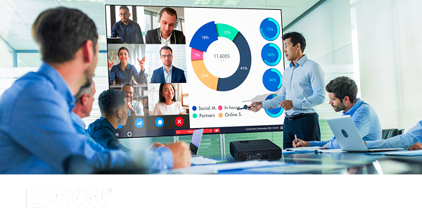 A team of executives watching a bright and colorful presentation on a screen in front of an Epson projector.