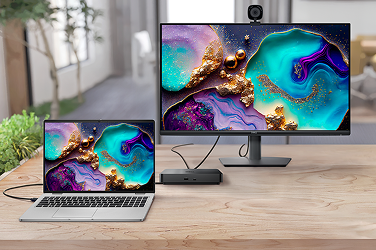 A Dell laptop computer, monitor and webcam connected by a dock.