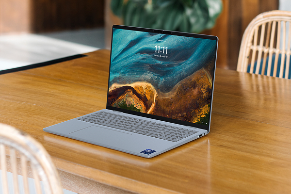 A Dell 16 Plus Laptop computer on a dining room table.