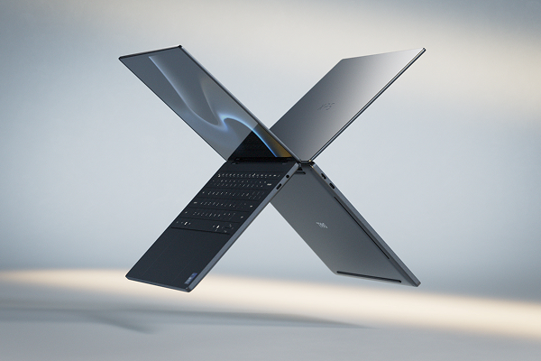 Two Dell XPS laptop computers floating in midair in the shape of the letter “X”.