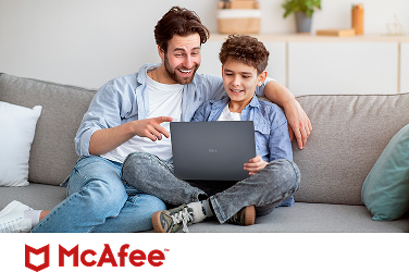 A carefree parent and child on a couch enjoying watching a video on a Dell laptop computer above a McAfee logo.