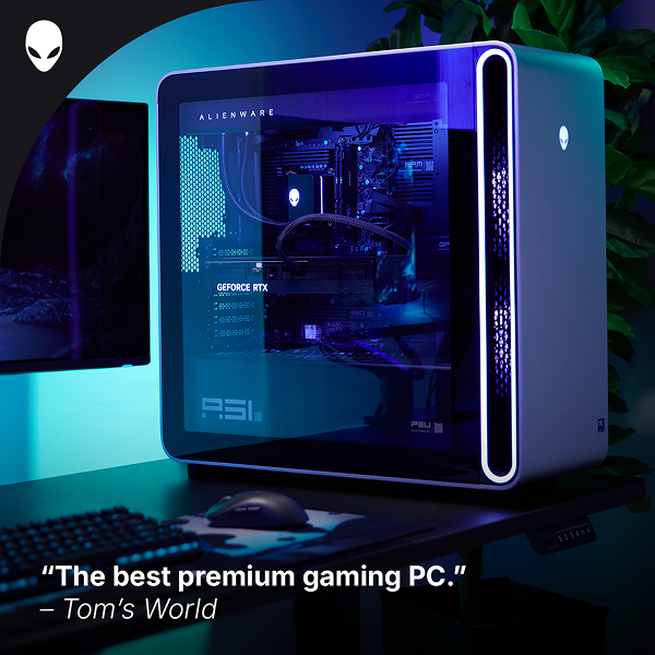An Alienware Area-51 Gaming Desktop computer in a dramatically lit home office.