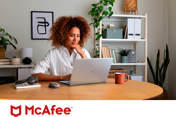 A confident remote worker reviewing their project on a Dell laptop computer above a McAfee logo.