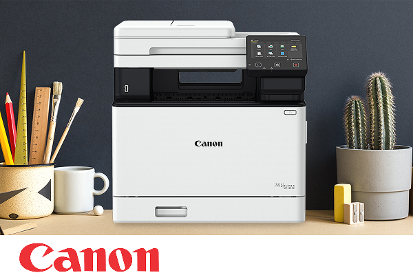 A Canon multifunction printer on an office desktop.