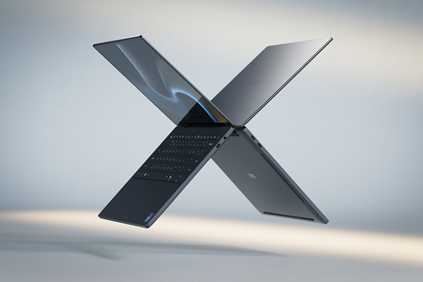 Two Dell XPS laptop computers floating in midair in the shape of the letter “X”.