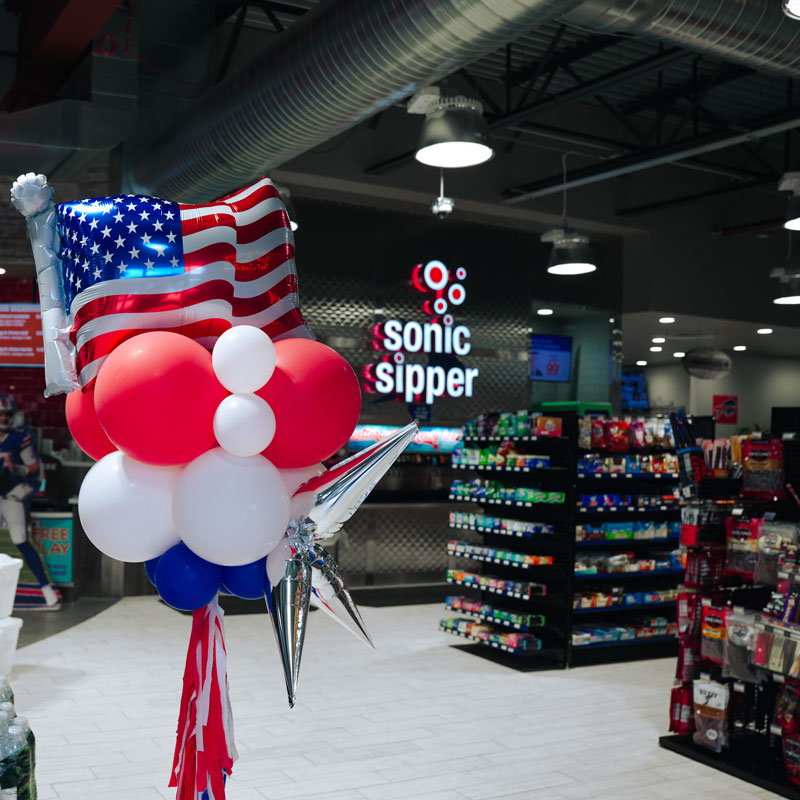 a patriotic balloon in a store with an american flag
