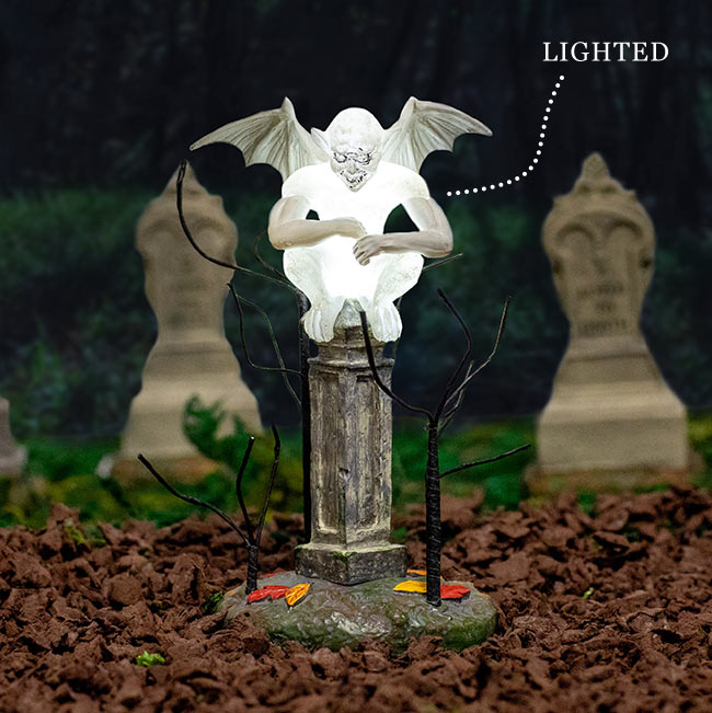 Glowing ghost statue guarding a graveyard