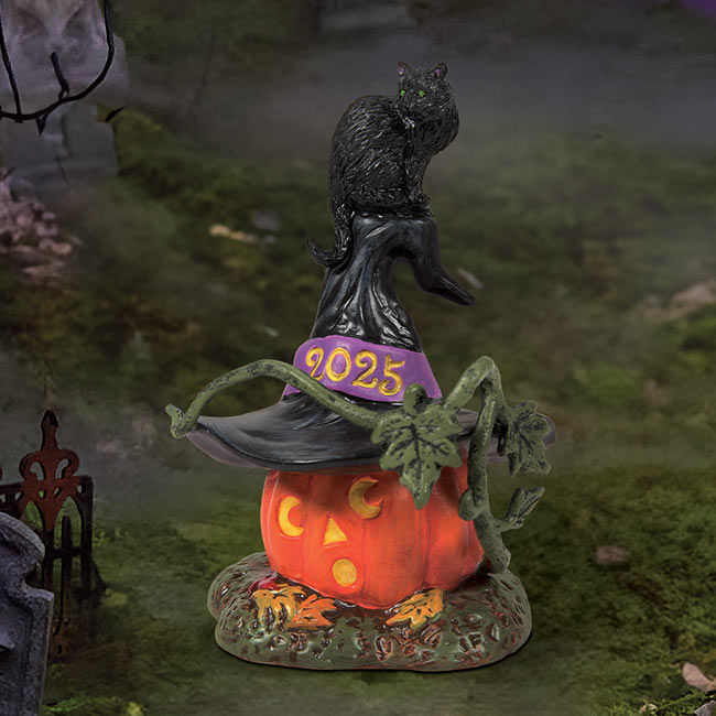 Feline Noir 2025 figurine with black cat on a pumpkin.