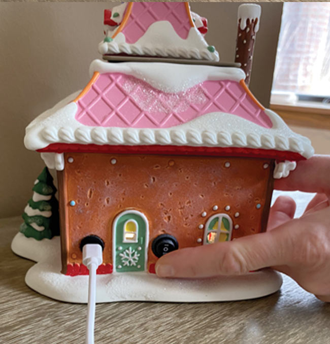 Use the switch located on the back of the building to turn the wax warmer on.