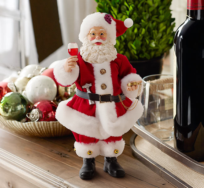 Santa unwinds with a well-earned glass of red.