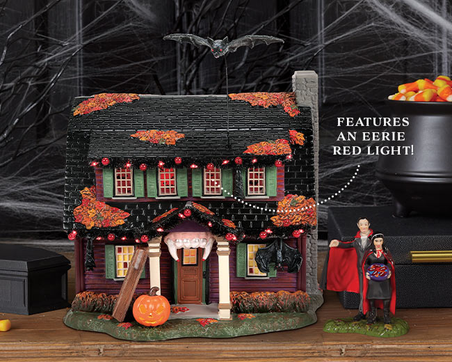 The Vampire House lighted building and A Fangtastic Halloween figurine