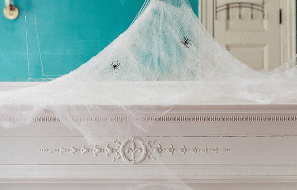 "Extreme Value, Everyday Favorites. Shop Thousands of Thrilling Finds" and a gif of a skull, candles, spider webs with spiders and halloween florals on a mantle.