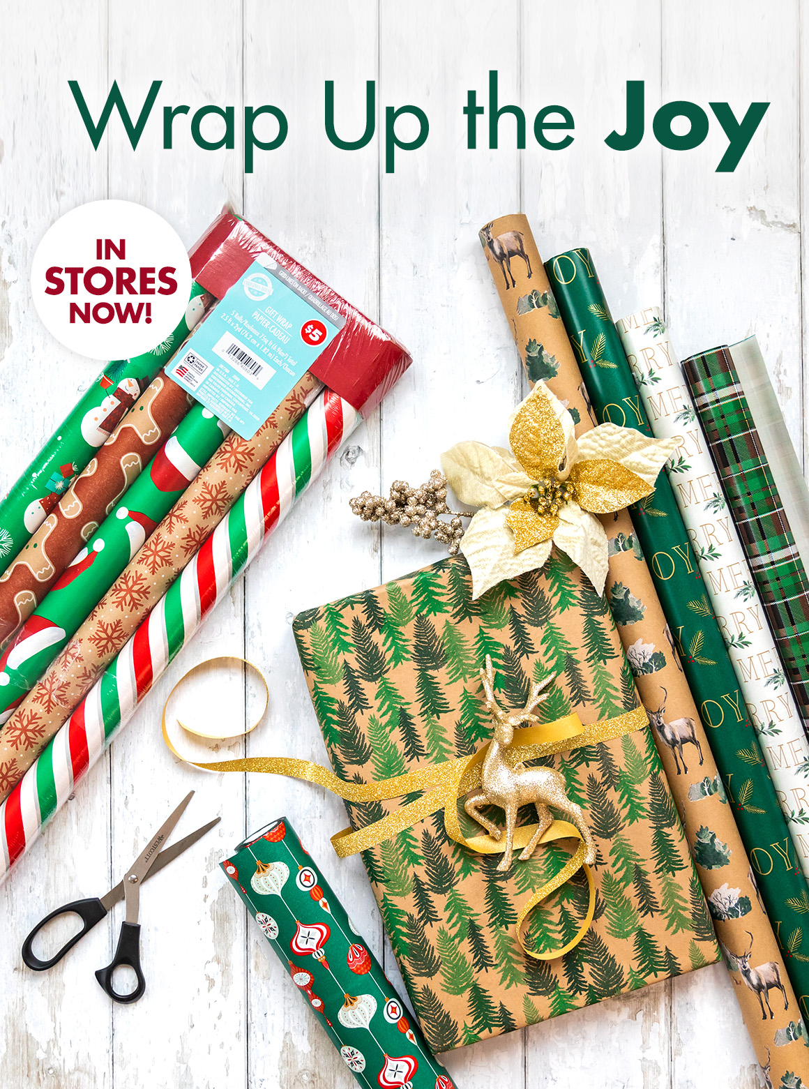 Image of gift wrap, scissors, ribbon, and floral with the headline saying "Wrap Up the Joy. In stores Now"
