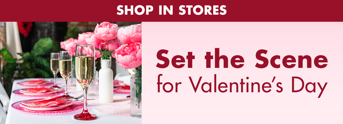 Image of a table set for Valentine’s Dinner with glassware, table settings, and floral with a headline saying “Shop in Stores. Set the scene for Valentine’s Day"