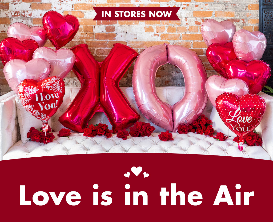 Headline: Love is in the air and an image of Valentine's Day helium balloons