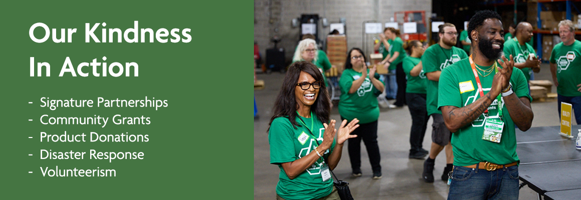 Our Kindness in Action includes signature partnerships, community grants, product donations, disaster response and volunteerism. A group of Dollar Tree Kindness Crew associates shown smiling and clapping at Phoenix event. 