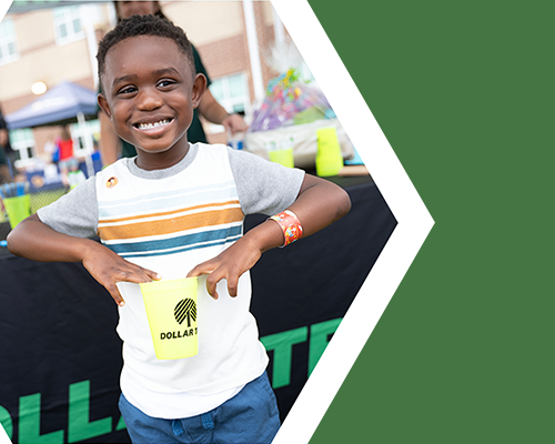 A young kid smiling at&nbsp;National Night Out Community Safety Event