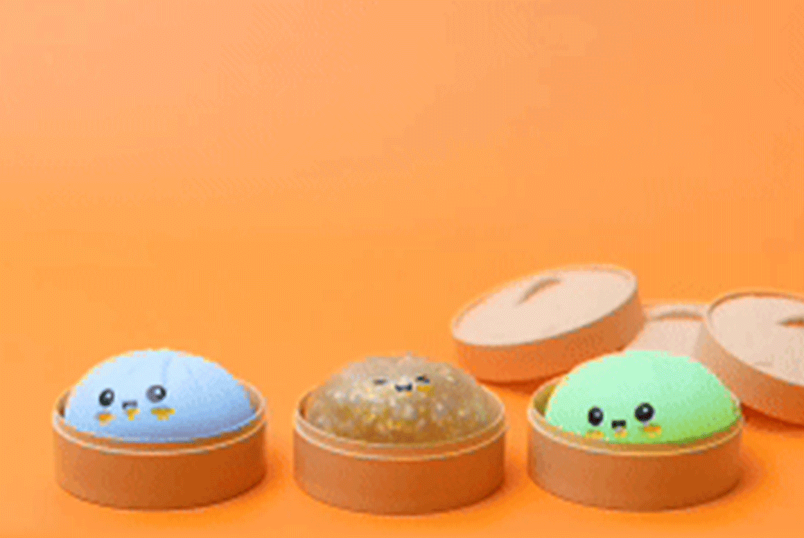 Animation of hands with chopsticks picking up dumpling toys from their steamer containers