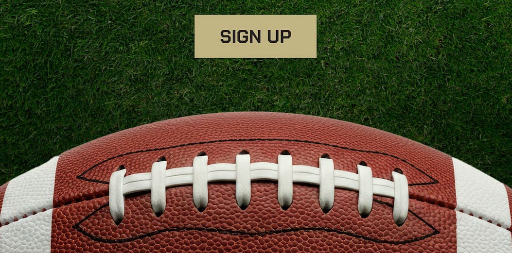 Sign up button. A football on a grass background.