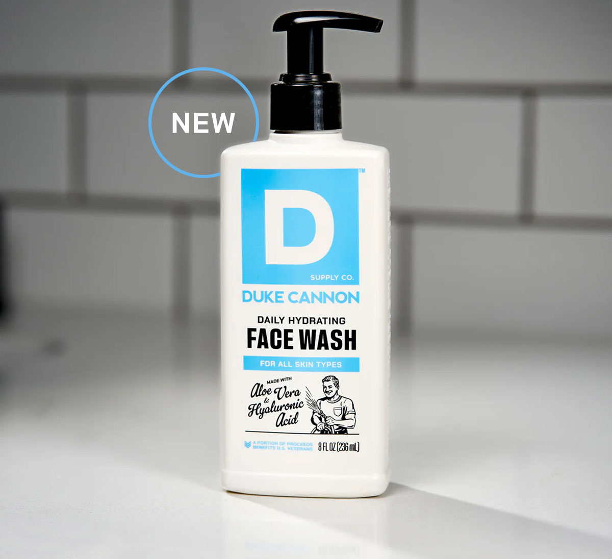 Duke Cannon Daily Hydrating Face Wash for all skin types. The bottle is on a bathroom counter.