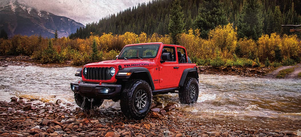 Buy American Legend - Button. Features a jeep with an American flag in the forest.