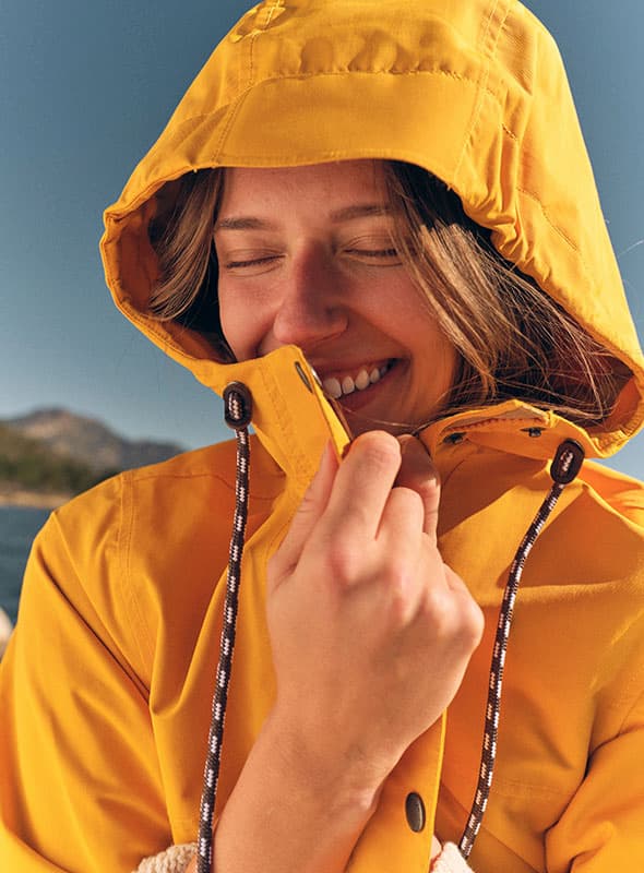 Women wearing yellow jacket with joy.