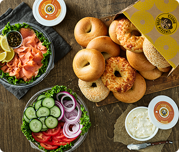 Box of bagels and shmear with lox and vegetables