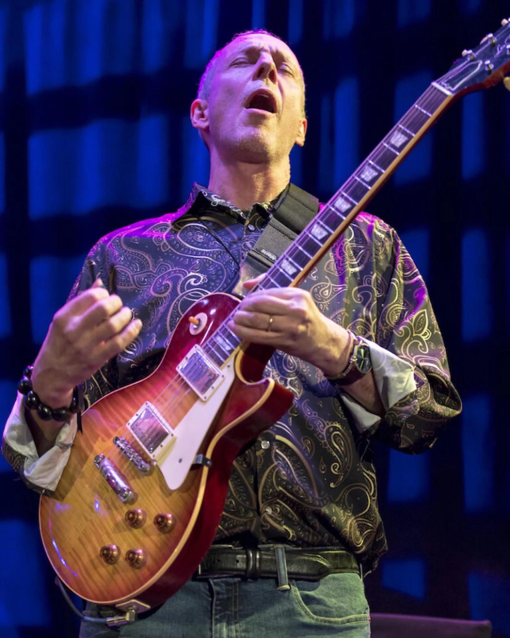 Joel Harrison, guitar in hands with his head thrown back and eyes closed in a powerful moment. Photo by Scott Friedlander