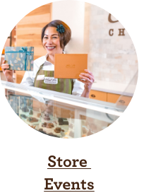 Store Associate serving Ethel M Chocolates at the counter.